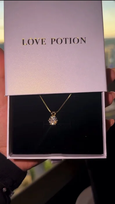 The Heartstruck necklace in its Love Potion box
